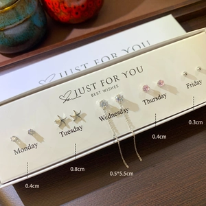 Detail view of S925 silver earring set gift box featuring stars and heart zircons