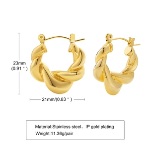 Detail view of gold-plated stainless steel twisted hoop earrings with 23mm dimensions