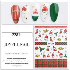 Detail of self-adhesive Christmas nail stickers with Santa Claus and reindeer designs