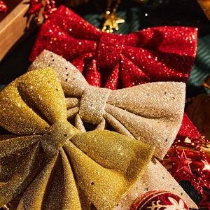 Glitter Christmas bows in red, gold, and champagne for festive tree and wreath decoration