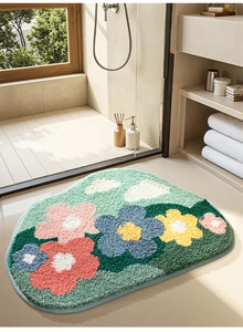 Detailed plush texture of irregular floral bathroom mat with colorful flower patterns