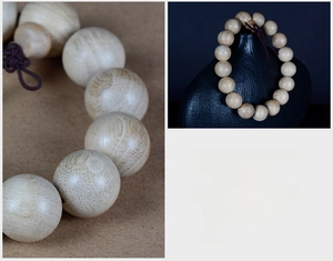 Macro shot of natural camphor wood beads showing smooth texture and elegant wood grain patterns