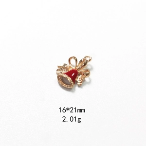 Detailed view of a 16x21mm red enamel Christmas bell pendant with a gold bow