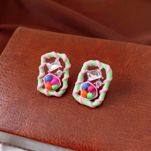 Detail view of vintage square stud earrings with colorful glass beads and zircon stones