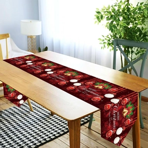 Christmas table runner with Merry Christmas text, red ornaments and festive bells pattern