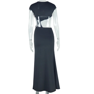 Detail of the irregular backless cutout design on this long black sleeveless fishtail dress