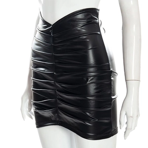 Macro shot of black ruched PU leather skirt with high-waisted V-cut design detail