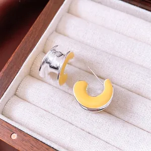 Chic C-shaped yellow enamel earrings with wide groove in a premium jewelry box