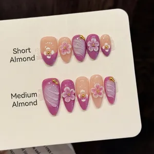 3D floral press-on nails with purple gradient design in almond shape on display
