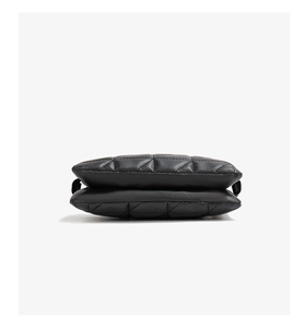 Detail view of the black quilted faux leather small bag with double-layer structure