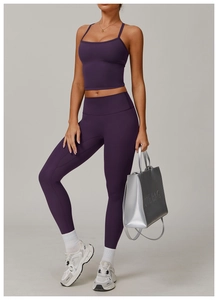 Macro shot of high-waist plum yoga leggings and matching square neck sports bra