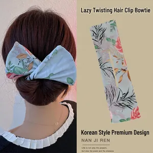 Floral print hair bun maker detail showing model back view and fabric bow design