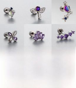 Detail showing titanium steel studs with purple zircon hearts and butterfly designs