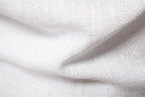 Macro shot showing the breathable texture and fine weave of the white linen cotton fabric