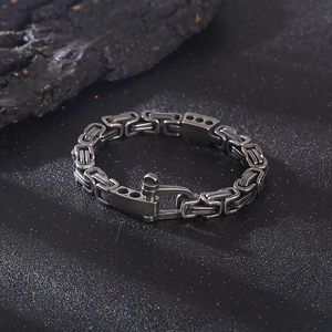 Macro shot of punk style stainless steel Byzantine chain bracelet with U-shaped clasp