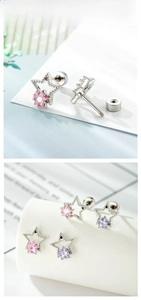 Detailed macro view of star-shaped titanium cartilage studs with pink and purple zircon