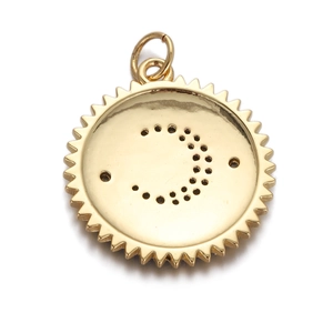 Macro view of gold-plated sunburst pendant with crescent moon zircon detail