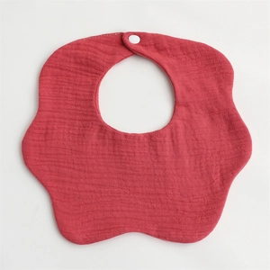 Detailed view of dark red flower shaped 6-layer cotton gauze baby bib with snap button