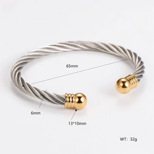 Detail view of two-tone cable bangle showing 65mm inner diameter and 6mm width dimensions