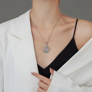 Chic beaded necklace with colorful zircon lollipop pendant worn by model in white suit