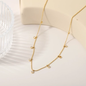 Minimalist 18k gold plated titanium necklace with circular white zircon beads for women