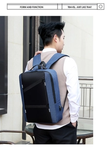 Blue and black laptop backpack side view featuring integrated external USB charging port