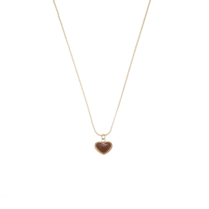 Elegant gold titanium chain necklace featuring a red enamel heart pendant on white background