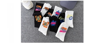 Detail of cotton crew socks featuring colorful graffiti prints and street style slogans