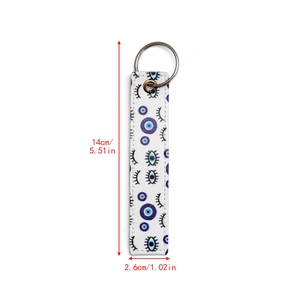 Detail view of Evil Eye faux leather keychain with exact size dimensions 14cm by 2.6cm