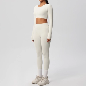 Detail view of off-white long-sleeved yoga set with high-waist slimming fitness leggings