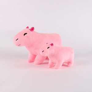 Close-up of two pink Capybara plush toys in different sizes with soft texture