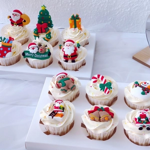 Christmas soft rubber cupcake toppers featuring Santa Claus and reindeer ornaments