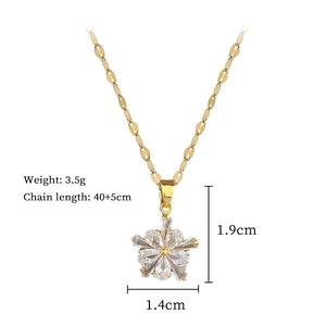 Detail view of flower pendant necklace with dimensions 1.9cm by 1.4cm and 40cm chain length