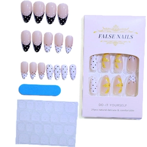 French press-on nails set with black polka dots and yellow floral designs for women