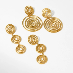 Minimalist gold spiral hoop and triple twist drop earrings in modern metal design