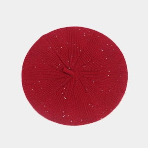 Detailed top view of red knitted sequin beret showing rabbit hair texture and glitter