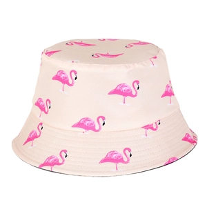 Detailed view of pink flamingo patterns on cotton canvas bucket hat fabric