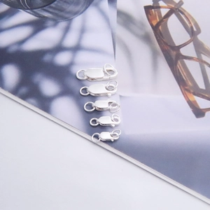 Macro detail of five assorted sizes of S925 sterling silver square spring lobster clasps