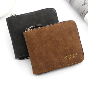 Detail of brown and grey zipper wallets with vintage matte leather and logo stamp