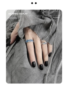 Wearing display of two S925 silver rings with blue enamel texture and stone inlay