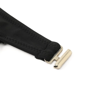 Detail of black elastic bikini strap with premium gold metal clasp and zigzag stitching