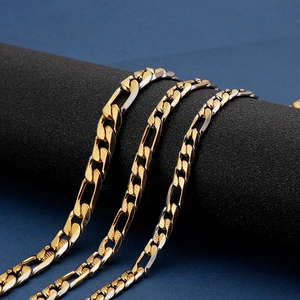 Professional display of two-tone gold and silver Figaro link necklaces in stainless steel