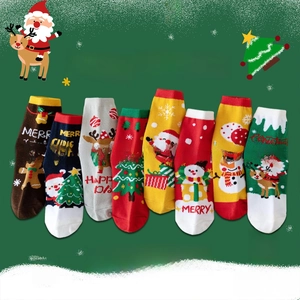 Detailed view of Christmas themed cotton socks featuring Santa Claus and reindeer patterns