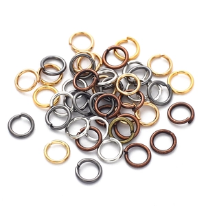 Close-up of assorted metal jump rings in gold silver and bronze for DIY jewelry making