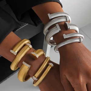 Hiphop style spiral nail bracelet with pavé rhinestones in gold and silver finish