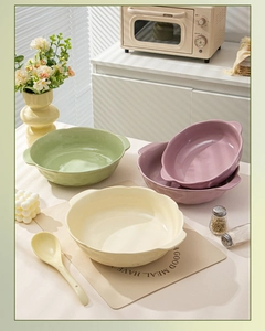 Close-up of ceramic soup bowl with handles in cream finish for home dining