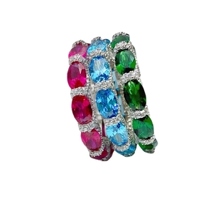 925 silver sterling rings with oval red, blue, and green gemstones in a stacked view