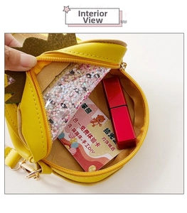 Detail view showing interior capacity of yellow round pineapple purse with zipper closure