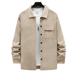 Macro detail of men's beige heavy twill jacket with collar and single-breasted buttons