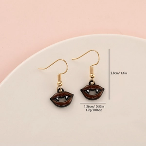 Detail view of vampire lip earrings with size measurements 2.8cm and weight 1.7g